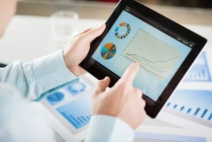 Reviewing financial charts on a tablet